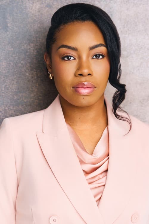 Michelle Renée Gomes headshot, pink blazer